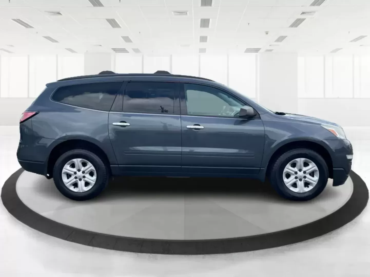 2014 Cyber Gray Metallic Chevrolet Traverse LS FWD w/PDC (1GNKRFED9EJ) with an 3.6L V6 DOHC 24V engine, 6-Speed Automatic transmission, located at 880 E. National Road, Vandalia, OH, 45377, (937) 908-9800, 39.891918, -84.183594 - 2014 Chevrolet Traverse LS FWD w/PDC - Photo#1