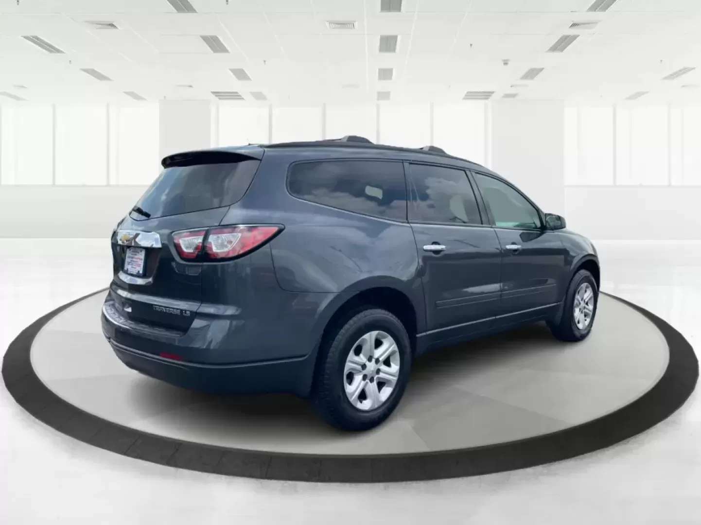 2014 Cyber Gray Metallic Chevrolet Traverse LS FWD w/PDC (1GNKRFED9EJ) with an 3.6L V6 DOHC 24V engine, 6-Speed Automatic transmission, located at 880 E. National Road, Vandalia, OH, 45377, (937) 908-9800, 39.891918, -84.183594 - 2014 Chevrolet Traverse LS FWD w/PDC - Photo#2