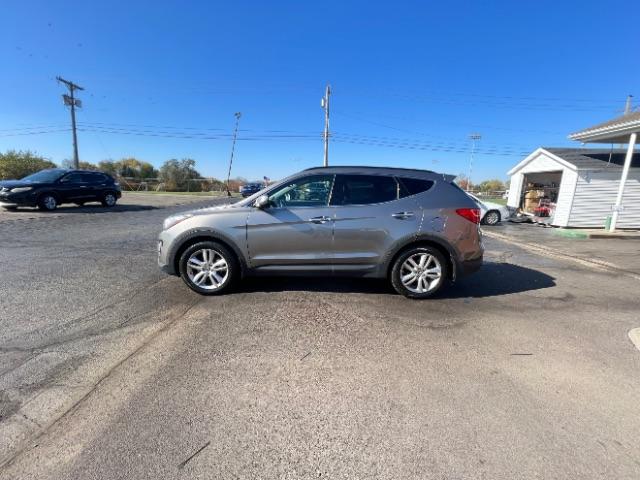 2013 Moonstone Silver Hyundai Santa Fe Sport 2.0 AWD (5XYZUDLAXDG) with an 2.0L L4 DOHC 16V engine, 6-Speed Automatic transmission, located at 1099 N County Rd 25A , Troy, OH, 45373, (937) 908-9800, 40.057079, -84.212883 - Photo #6