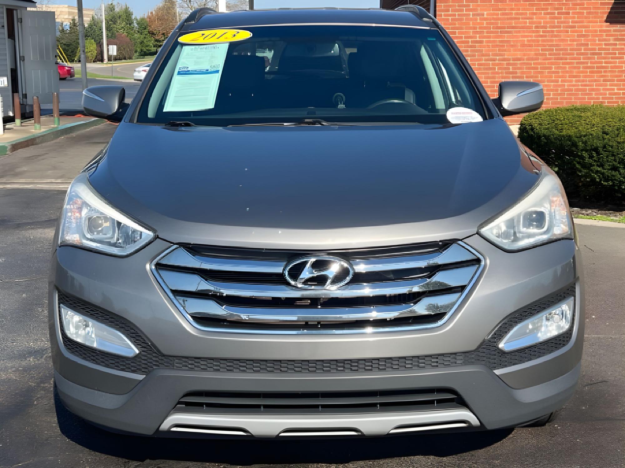 2013 Moonstone Silver Hyundai Santa Fe Sport 2.0 AWD (5XYZUDLAXDG) with an 2.0L L4 DOHC 16V engine, 6-Speed Automatic transmission, located at 1099 N County Rd 25A, Troy, OH, 45373, (937) 908-9800, 40.057079, -84.212883 - Photo #11