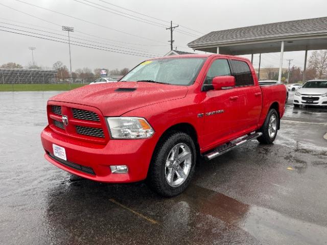 2012 Flame Red RAM 1500 Sport Crew Cab 4WD (1C6RD7MT9CS) with an 5.7L V8 OHV 16V engine, 6-Speed Automatic transmission, located at 1951 S Dayton Lakeview Rd., New Carlisle, OH, 45344, (937) 908-9800, 39.890999, -84.050255 - Photo #2