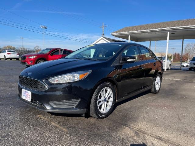 2017 Shadow Black Ford Focus SE Sedan (1FADP3F20HL) with an 2.0L L4 DOHC 16V engine, located at 1099 N County Rd 25A , Troy, OH, 45373, (937) 908-9800, 40.057079, -84.212883 - Photo #2