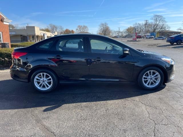 2017 Shadow Black Ford Focus SE Sedan (1FADP3F20HL) with an 2.0L L4 DOHC 16V engine, located at 1099 N County Rd 25A, Troy, OH, 45373, (937) 908-9800, 40.057079, -84.212883 - Photo #6