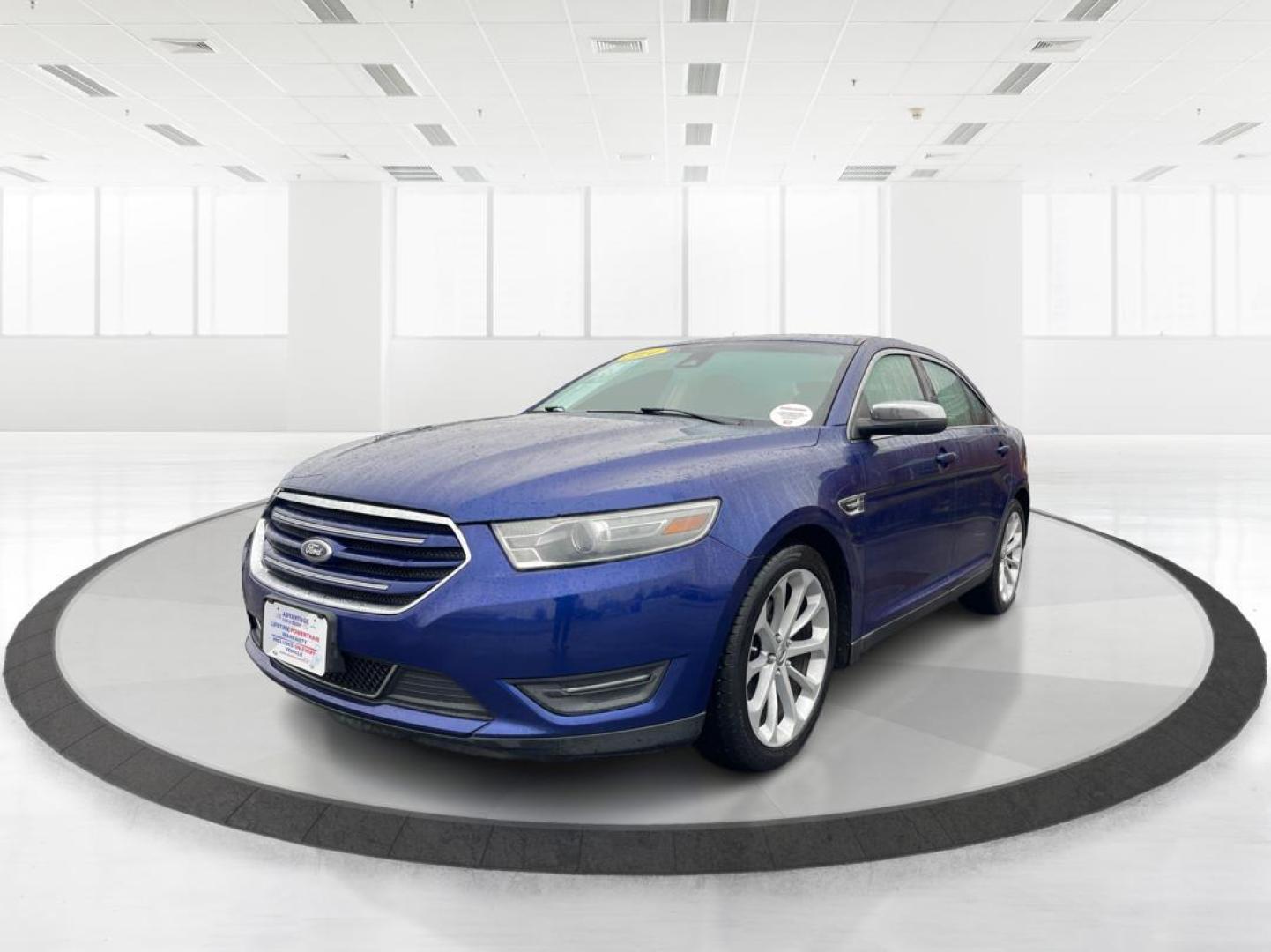 2014 Deep Impact Blue Metallic Ford Taurus Limited AWD (1FAHP2J86EG) with an 3.5L V6 DOHC 24V engine, 6-Speed Automatic transmission, located at 1184 Kauffman Ave, Fairborn, OH, 45324, (937) 908-9800, 39.807072, -84.030914 - 2014 Ford Taurus Limited AWD - Photo#7