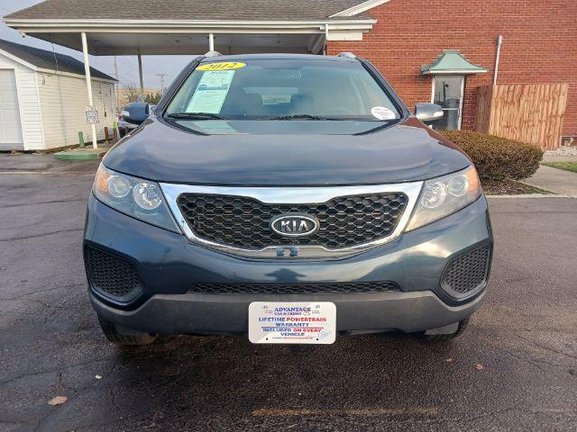 2012 Pacific Blue Kia Sorento LX 4WD (5XYKTDA2XCG) with an 3.5L V6 DOHC 24V engine, 6-Speed Automatic transmission, located at 4508 South Dixie Dr, Moraine, OH, 45439, (937) 908-9800, 39.689976, -84.218452 - Photo #2