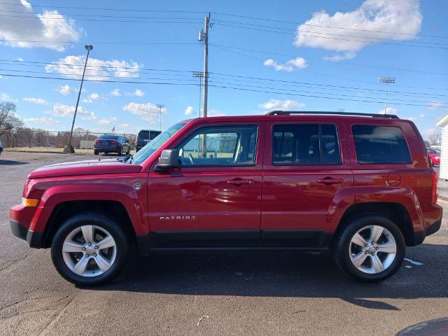 2014 Dp Cherry Red Crystal PC Jeep Patriot Latitude 4WD (1C4NJRFB0ED) with an 2.4L L4 DOHC 16V engine, located at 1230 East Main St, Xenia, OH, 45385, (937) 908-9800, 39.688026, -83.910172 - Photo #6