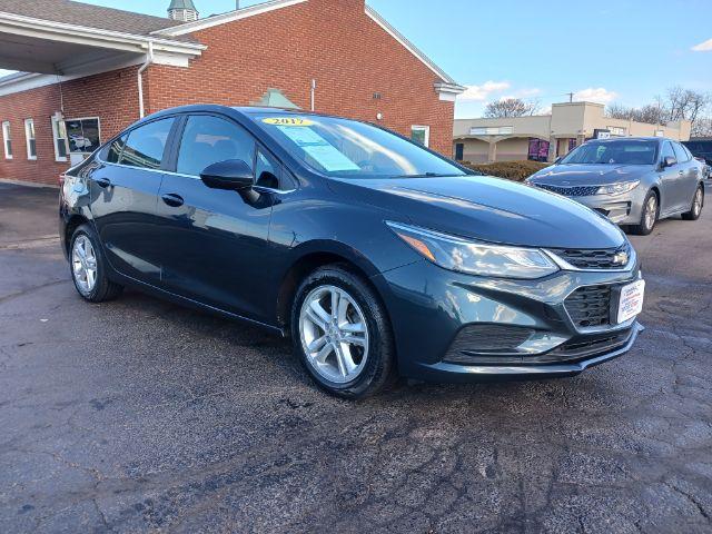 2017 Pepperdust Metallic Chevrolet Cruze LT Auto (3G1BE5SM0HS) with an 1.4L L4 DOHC 16V TURBO engine, 6-Speed Automatic transmission, located at 1099 N County Rd 25A , Troy, OH, 45373, (937) 908-9800, 40.057079, -84.212883 - Photo #0