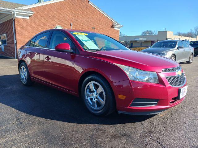 2014 Red Hot Chevrolet Cruze 1LT Auto (1G1PC5SB2E7) with an 1.4L L4 DOHC 16V TURBO engine, 6-Speed Automatic transmission, located at 1184 Kauffman Ave, Fairborn, OH, 45324, (937) 908-9800, 39.807072, -84.030914 - Photo #0