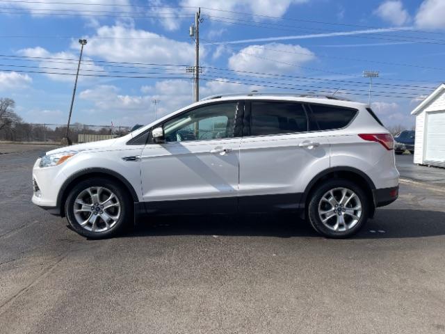 2015 White Platinum Met TC Ford Escape Titanium 4WD (1FMCU9J92FU) with an 2.0L L4 DOHC 16V engine, 6-Speed Automatic transmission, located at 880 E. National Road, Vandalia, OH, 45377, (937) 908-9800, 39.891918, -84.183594 - Photo #4