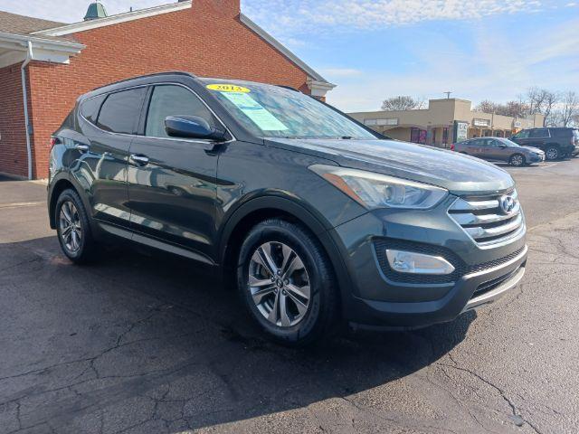 2013 Juniper Green Hyundai Santa Fe Sport 2.4 FWD (5XYZU3LB8DG) with an 2.4L L4 DOHC 16V engine, 6-Speed Automatic transmission, located at 1230 East Main St, Xenia, OH, 45385, (937) 908-9800, 39.688026, -83.910172 - Photo #0