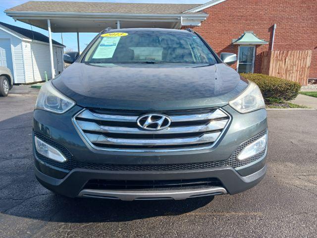 2013 Juniper Green Hyundai Santa Fe Sport 2.4 FWD (5XYZU3LB8DG) with an 2.4L L4 DOHC 16V engine, 6-Speed Automatic transmission, located at 1230 East Main St, Xenia, OH, 45385, (937) 908-9800, 39.688026, -83.910172 - Photo #2