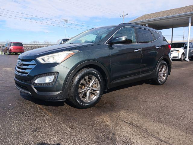 2013 Juniper Green Hyundai Santa Fe Sport 2.4 FWD (5XYZU3LB8DG) with an 2.4L L4 DOHC 16V engine, 6-Speed Automatic transmission, located at 1230 East Main St, Xenia, OH, 45385, (937) 908-9800, 39.688026, -83.910172 - Photo #4