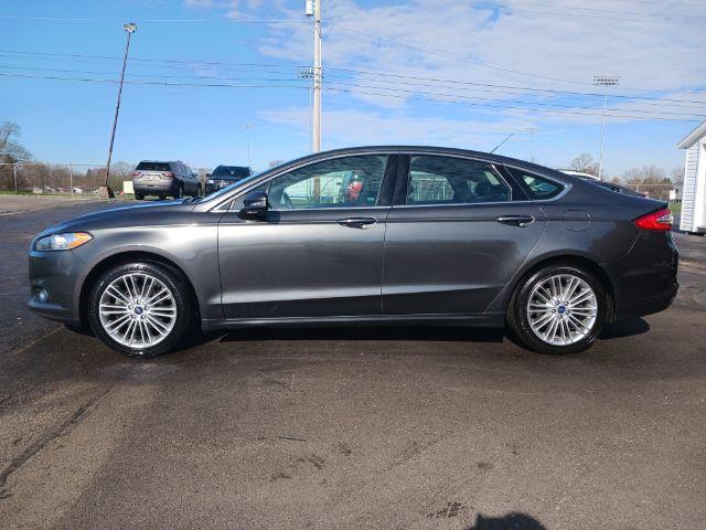 2016 Shadow Black Ford Fusion SE AWD (3FA6P0T99GR) with an 2.0L L4 DOHC 16V engine, 6-Speed Automatic transmission, located at 1099 N County Rd 25A , Troy, OH, 45373, (937) 908-9800, 40.057079, -84.212883 - Photo #6