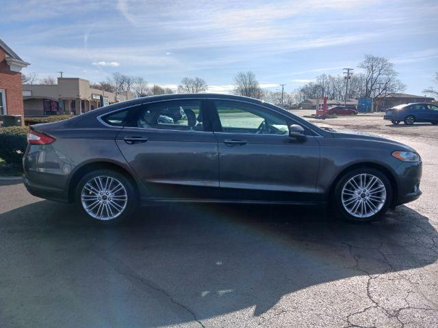 2016 Shadow Black Ford Fusion SE AWD (3FA6P0T99GR) with an 2.0L L4 DOHC 16V engine, 6-Speed Automatic transmission, located at 1184 Kauffman Ave, Fairborn, OH, 45324, (937) 908-9800, 39.807072, -84.030914 - Photo #8