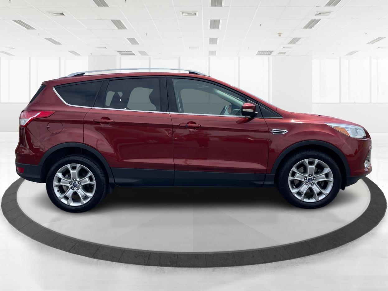 2014 Ruby Red Tinted CC Ford Escape Titanium FWD (1FMCU0J96EU) with an 2.0L L4 DOHC 16V engine, 6-Speed Automatic transmission, located at 401 Woodman Dr, Riverside, OH, 45431, (937) 908-9800, 39.760899, -84.123421 - Photo #1