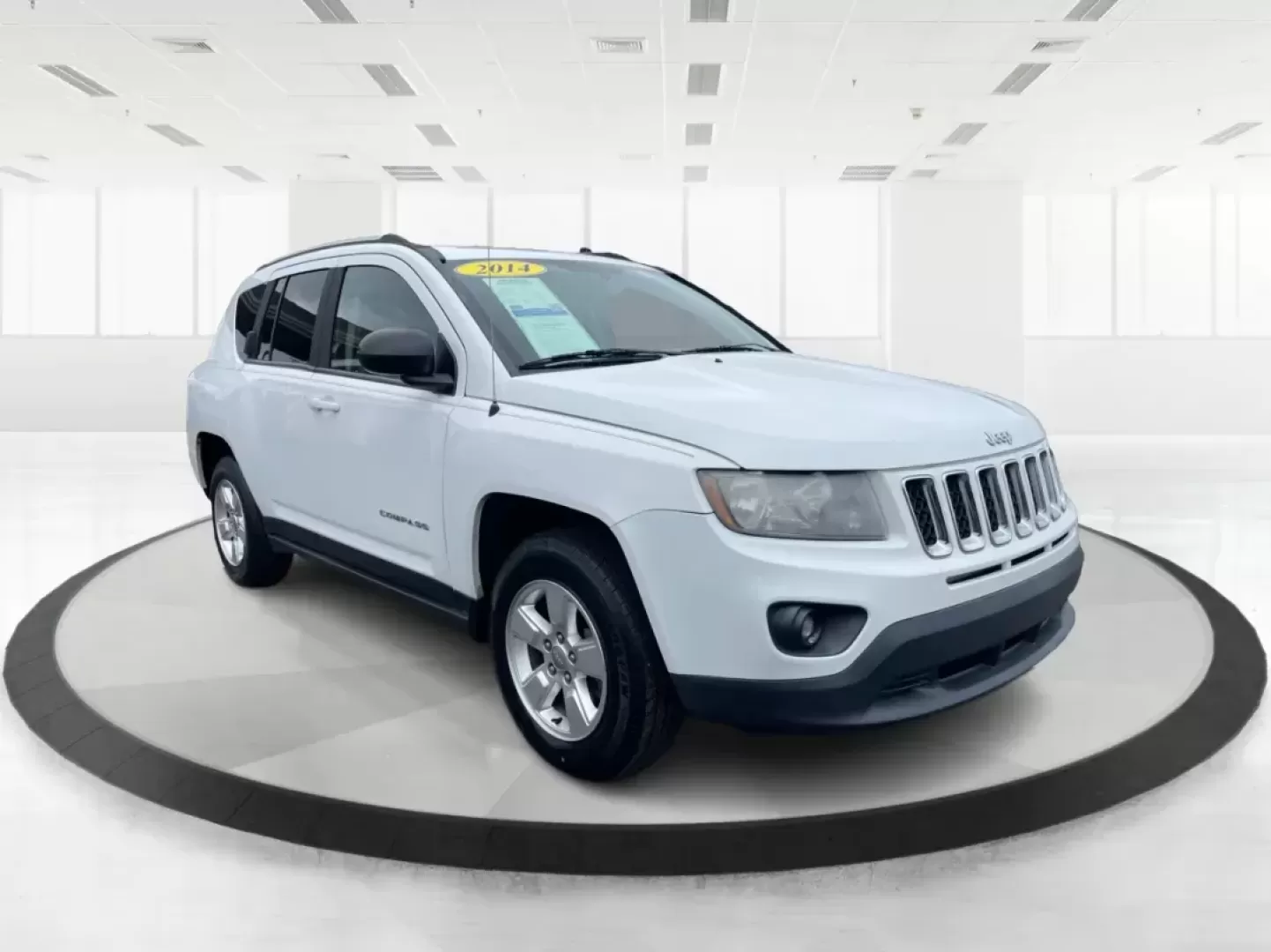 2014 Bright White Clearcoat Jeep Compass Sport FWD (1C4NJCBA9ED) with an 2.0L L4 DOHC 16V engine, located at 880 E. National Road, Vandalia, OH, 45377, (937) 908-9800, 39.891918, -84.183594 - 2014 Jeep Compass Sport FWD - Photo#0