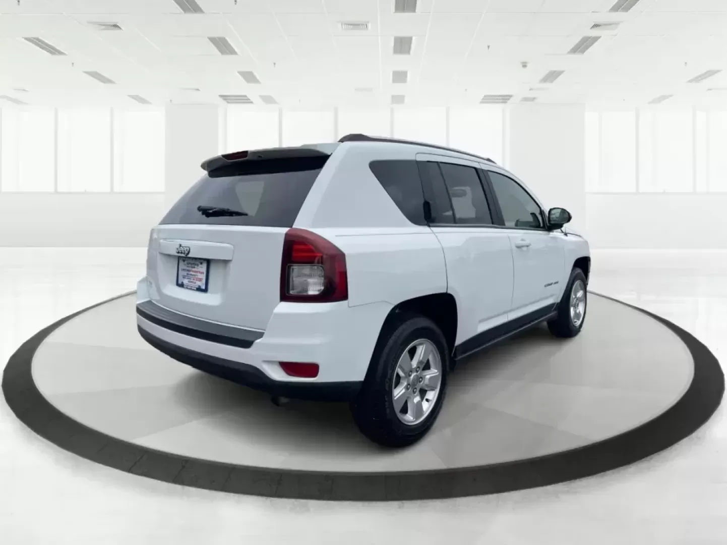 2014 Bright White Clearcoat Jeep Compass Sport FWD (1C4NJCBA9ED) with an 2.0L L4 DOHC 16V engine, located at 880 E. National Road, Vandalia, OH, 45377, (937) 908-9800, 39.891918, -84.183594 - 2014 Jeep Compass Sport FWD - Photo#2