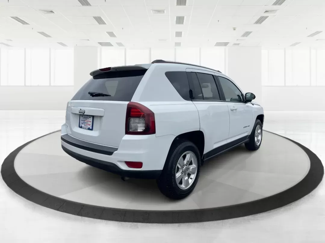 2014 Bright White Clearcoat Jeep Compass Sport FWD (1C4NJCBA9ED) with an 2.0L L4 DOHC 16V engine, located at 880 E. National Road, Vandalia, OH, 45377, (937) 908-9800, 39.891918, -84.183594 - 2014 Jeep Compass Sport FWD - Photo#2