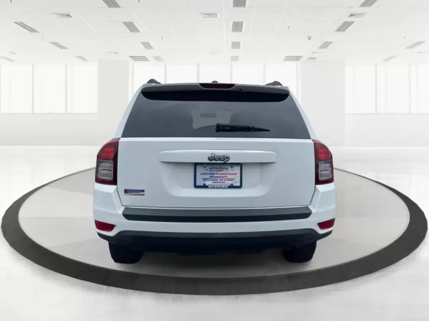 2014 Bright White Clearcoat Jeep Compass Sport FWD (1C4NJCBA9ED) with an 2.0L L4 DOHC 16V engine, located at 880 E. National Road, Vandalia, OH, 45377, (937) 908-9800, 39.891918, -84.183594 - 2014 Jeep Compass Sport FWD - Photo#3
