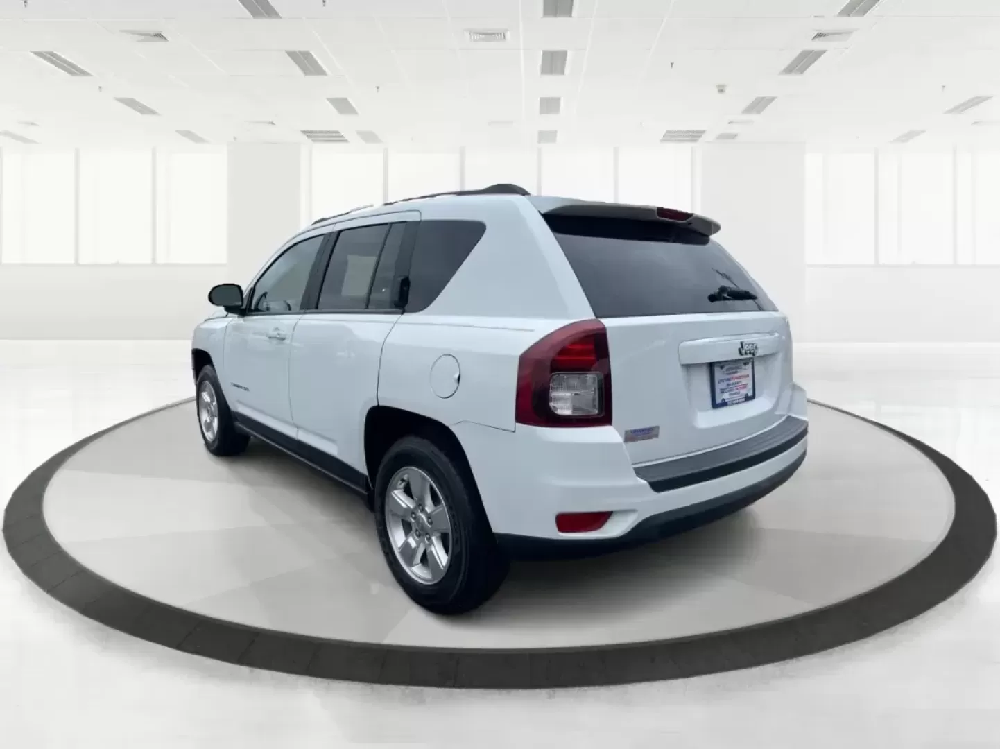 2014 Bright White Clearcoat Jeep Compass Sport FWD (1C4NJCBA9ED) with an 2.0L L4 DOHC 16V engine, located at 880 E. National Road, Vandalia, OH, 45377, (937) 908-9800, 39.891918, -84.183594 - 2014 Jeep Compass Sport FWD - Photo#4