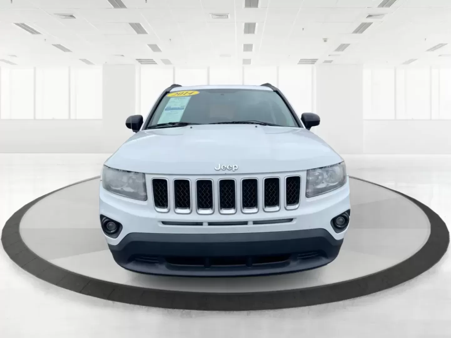 2014 Bright White Clearcoat Jeep Compass Sport FWD (1C4NJCBA9ED) with an 2.0L L4 DOHC 16V engine, located at 880 E. National Road, Vandalia, OH, 45377, (937) 908-9800, 39.891918, -84.183594 - 2014 Jeep Compass Sport FWD - Photo#6
