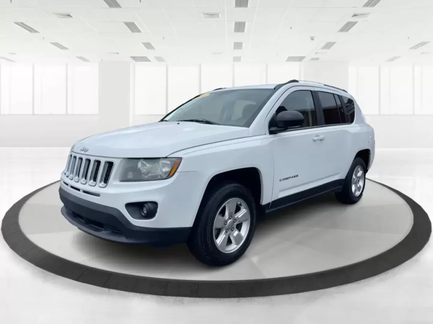 2014 Bright White Clearcoat Jeep Compass Sport FWD (1C4NJCBA9ED) with an 2.0L L4 DOHC 16V engine, located at 880 E. National Road, Vandalia, OH, 45377, (937) 908-9800, 39.891918, -84.183594 - 2014 Jeep Compass Sport FWD - Photo#7