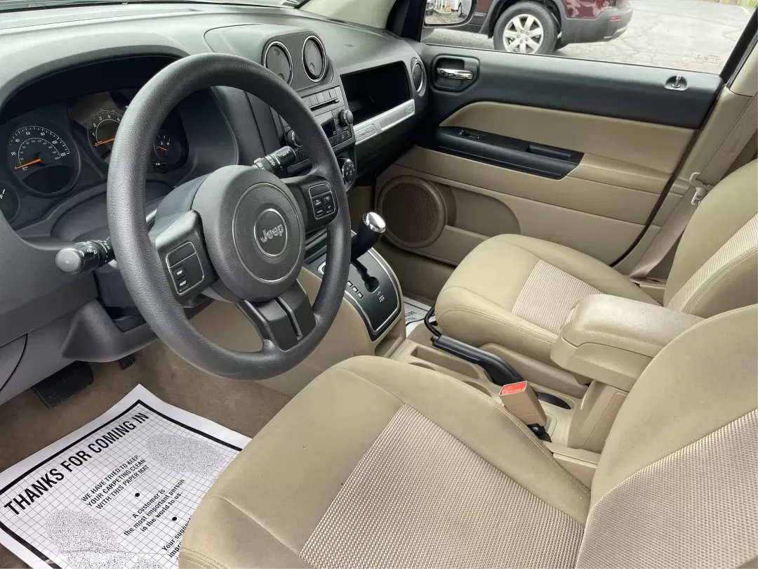 2014 Bright White Clearcoat Jeep Compass Sport FWD (1C4NJCBA9ED) with an 2.0L L4 DOHC 16V engine, located at 880 E. National Road, Vandalia, OH, 45377, (937) 908-9800, 39.891918, -84.183594 - 2014 Jeep Compass Sport FWD - Photo#8