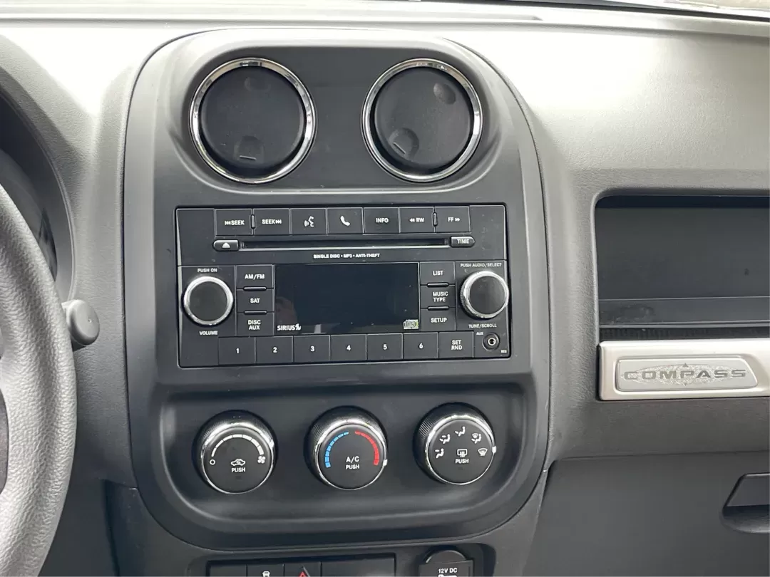 2014 Bright White Clearcoat Jeep Compass Sport FWD (1C4NJCBA9ED) with an 2.0L L4 DOHC 16V engine, located at 880 E. National Road, Vandalia, OH, 45377, (937) 908-9800, 39.891918, -84.183594 - 2014 Jeep Compass Sport FWD - Photo#11