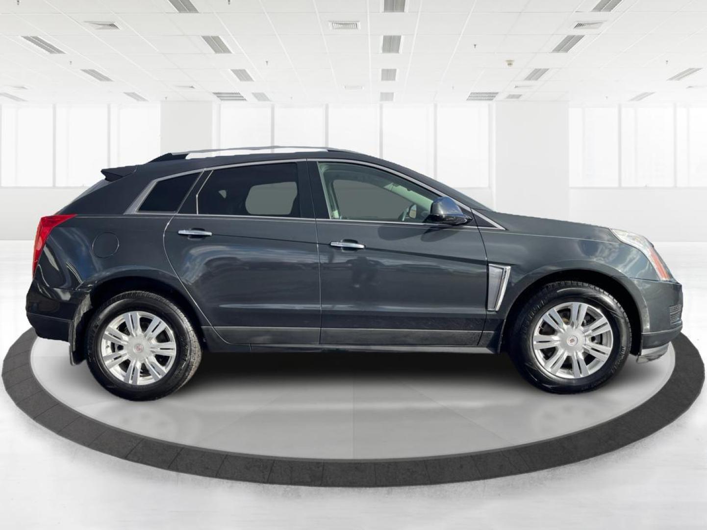 2015 Graphite Metallic Cadillac SRX Luxury Collection FWD (3GYFNBE3XFS) with an 3.6L V6 DOHC 24V FFV engine, 6-Speed Automatic transmission, located at 880 E. National Road, Vandalia, OH, 45377, (937) 908-9800, 39.891918, -84.183594 - 2015 Cadillac SRX Luxury Collection FWD - Photo#1