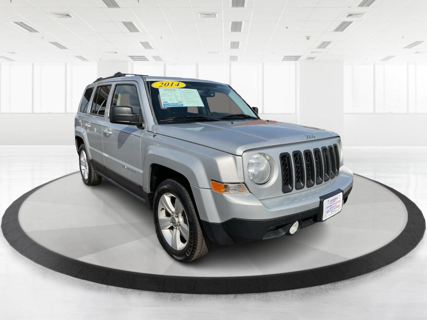2014 Bright Silver Metallic CC Jeep Patriot Latitude 2WD (1C4NJPFA5ED) with an 2.0L L4 DOHC 16V engine, located at 880 E. National Road, Vandalia, OH, 45377, (937) 908-9800, 39.891918, -84.183594 - 2014 Jeep Patriot Latitude 2WD - Photo#0