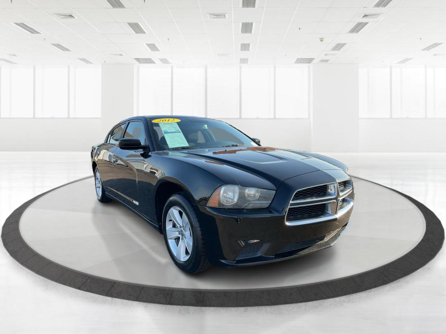2012 Pitch Black Dodge Charger SE (2C3CDXBGXCH) with an 3.6L V6 DOHC 24V engine, 5-Speed Automatic transmission, located at 401 Woodman Dr, Riverside, OH, 45431, (937) 908-9800, 39.760899, -84.123421 - Photo#0