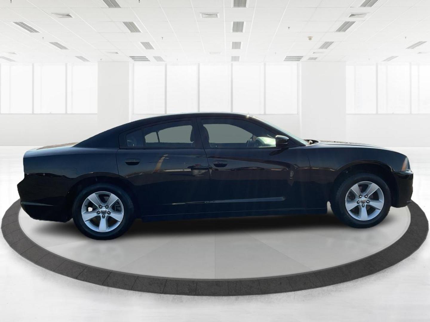 2012 Pitch Black Dodge Charger SE (2C3CDXBGXCH) with an 3.6L V6 DOHC 24V engine, 5-Speed Automatic transmission, located at 401 Woodman Dr, Riverside, OH, 45431, (937) 908-9800, 39.760899, -84.123421 - Photo#1
