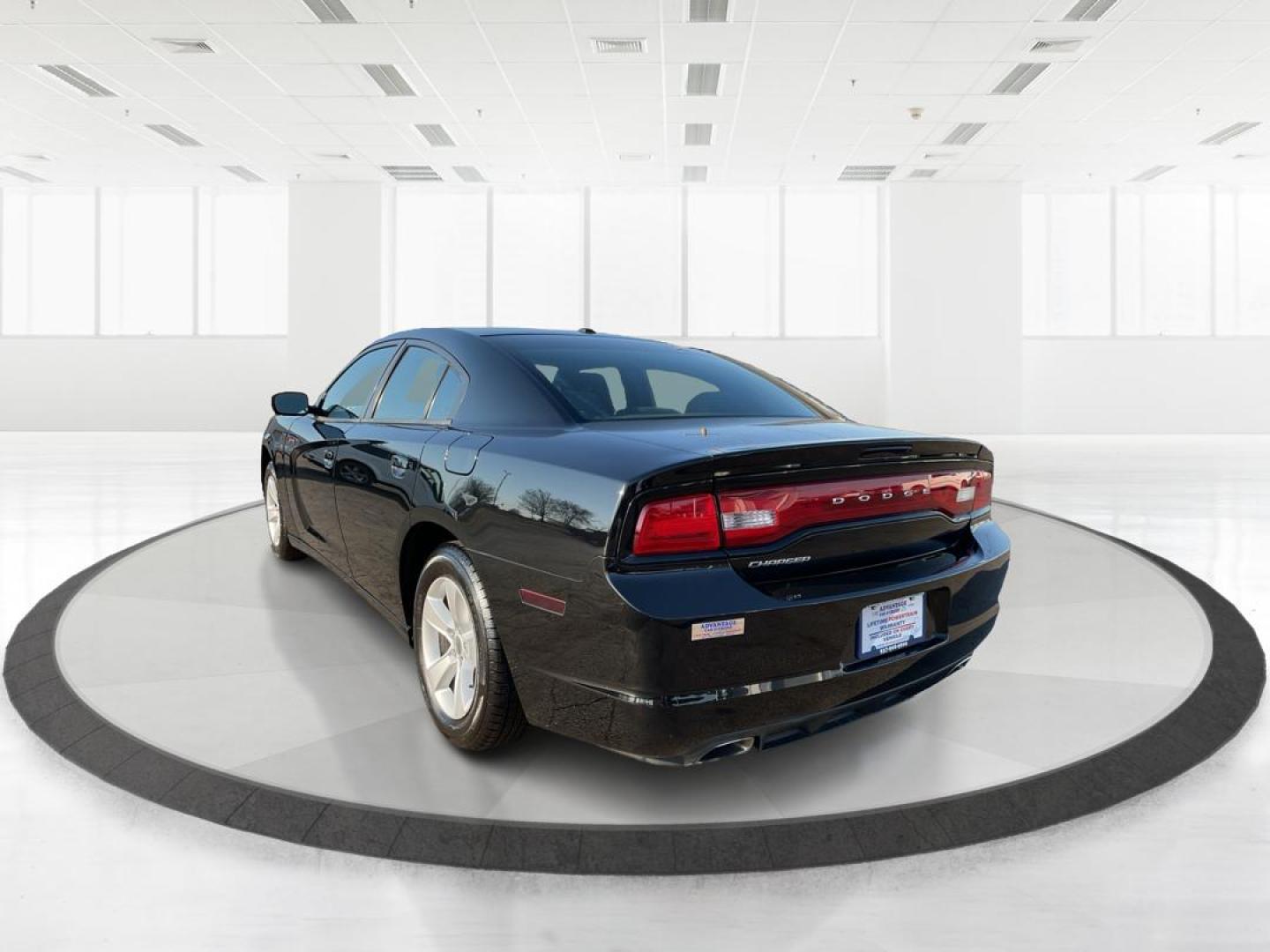 2012 Pitch Black Dodge Charger SE (2C3CDXBGXCH) with an 3.6L V6 DOHC 24V engine, 5-Speed Automatic transmission, located at 401 Woodman Dr, Riverside, OH, 45431, (937) 908-9800, 39.760899, -84.123421 - Photo#4