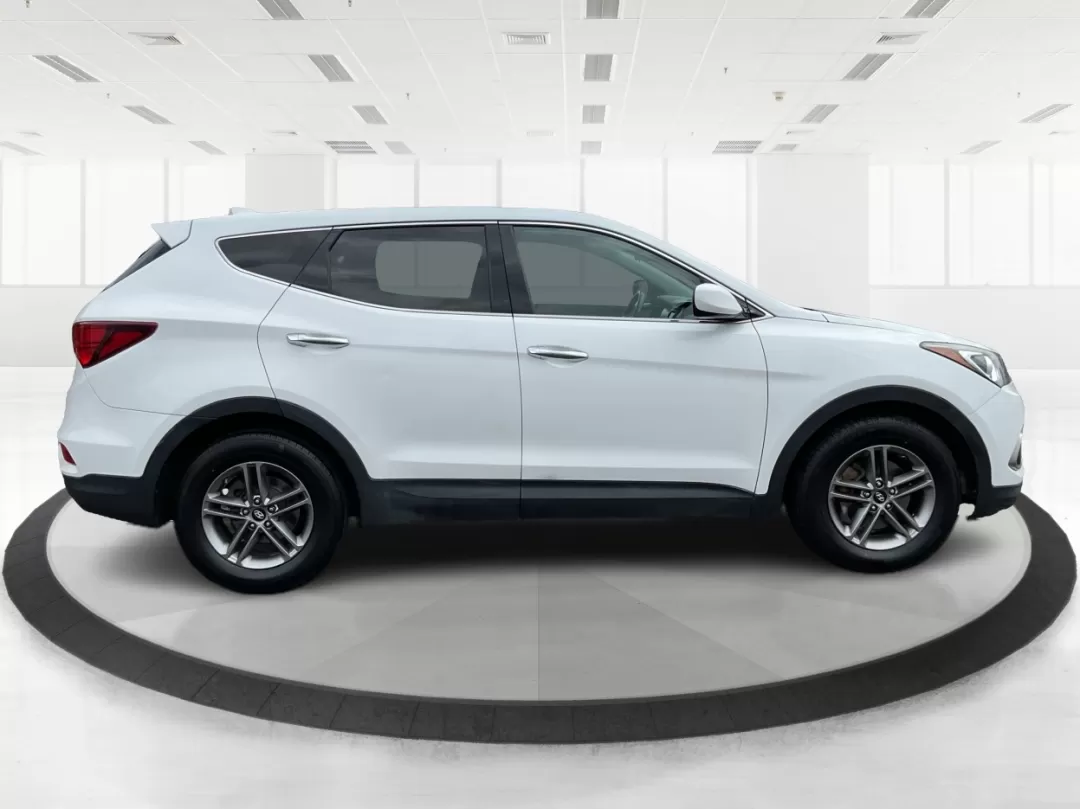 2017 Hyundai Santa Fe 2.4L (5NMZTDLB4HH) with an Theta II 2.4L I-4 gasoline direct injection engine, located at 880 E. National Road, Vandalia, OH, 45377, (937) 908-9800, 39.891918, -84.183594 - Photo#1