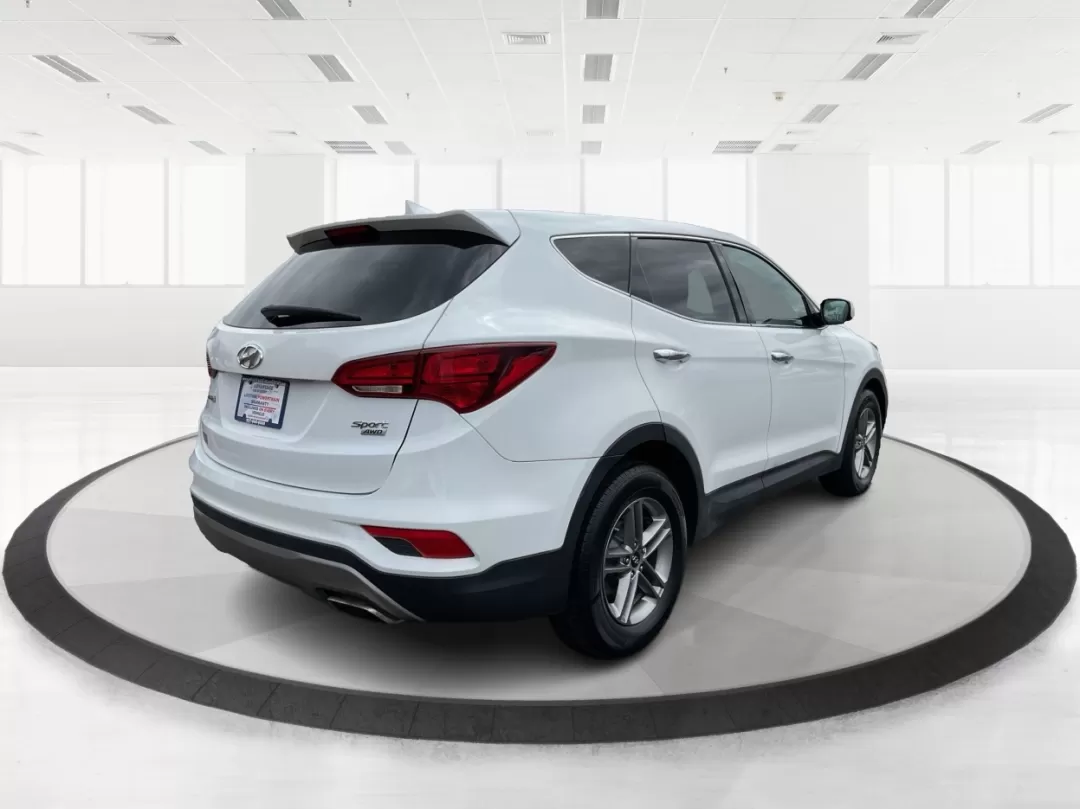2017 Hyundai Santa Fe 2.4L (5NMZTDLB4HH) with an Theta II 2.4L I-4 gasoline direct injection engine, located at 880 E. National Road, Vandalia, OH, 45377, (937) 908-9800, 39.891918, -84.183594 - Photo#2