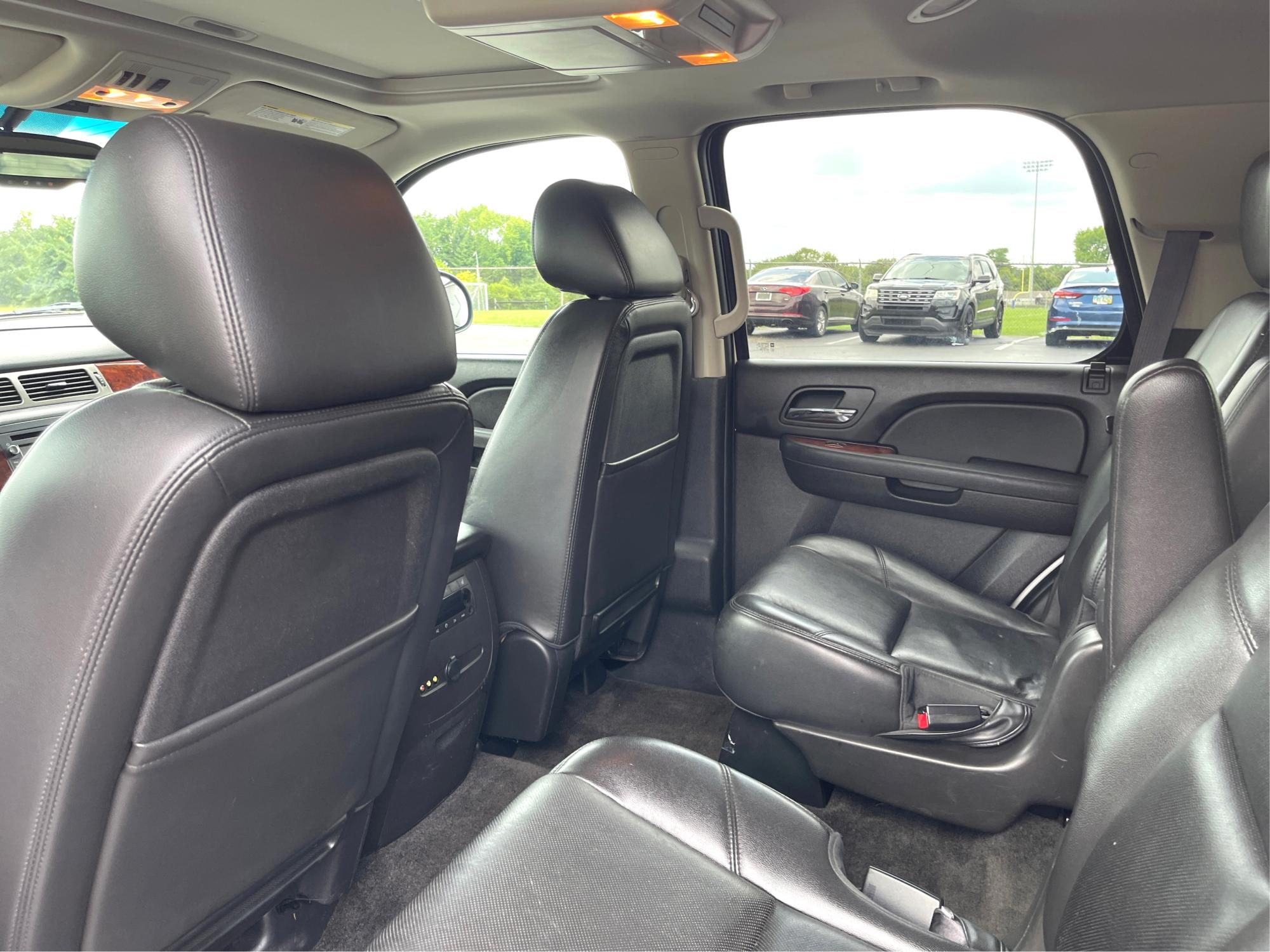 2013 Chevrolet Tahoe LTZ 4WD (1GNSKCE06DR) with an 5.3L V8 OHV 16V FFV engine, 6-Speed Automatic transmission, located at 401 Woodman Dr, Riverside, OH, 45431, (937) 908-9800, 39.760899, -84.123421 - Third Row - Photo#9