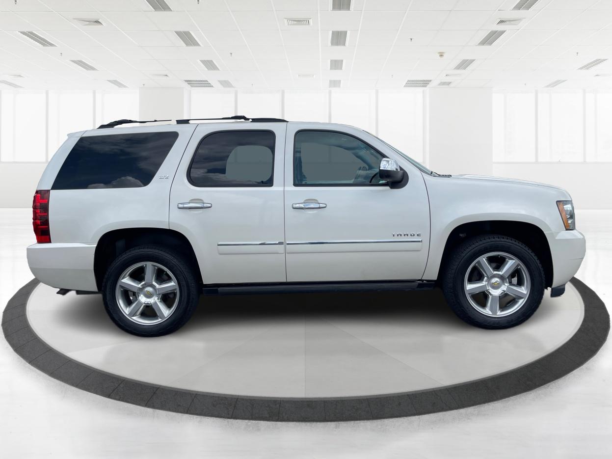 2013 Chevrolet Tahoe LTZ 4WD (1GNSKCE06DR) with an 5.3L V8 OHV 16V FFV engine, 6-Speed Automatic transmission, located at 401 Woodman Dr, Riverside, OH, 45431, (937) 908-9800, 39.760899, -84.123421 - Third Row - Photo#1