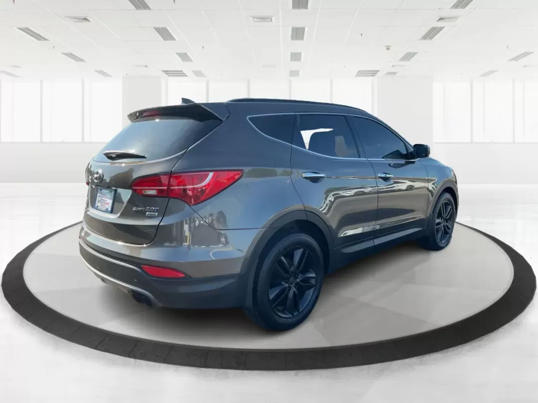 2013 Hyundai Santa Fe Sport 2.0 AWD (5XYZUDLA2DG) with an 2.0L L4 DOHC 16V engine, 6-Speed Automatic transmission, located at 1099 N County Rd 25A , Troy, OH, 45373, (937) 908-9800, 40.057079, -84.212883 - Photo#2