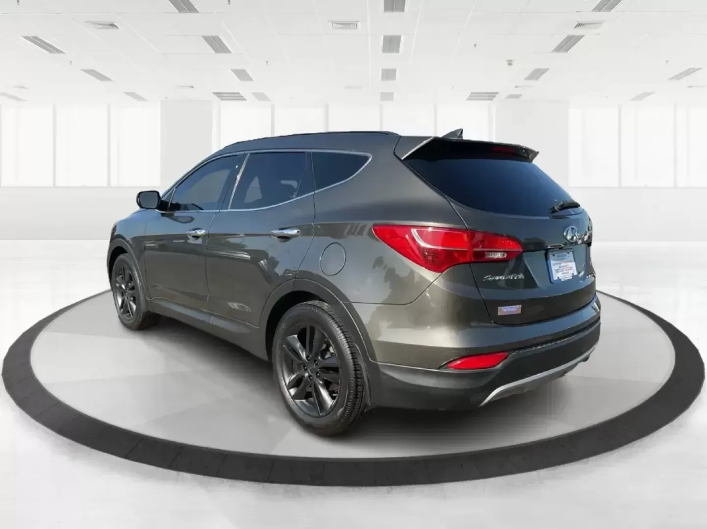 2013 Hyundai Santa Fe Sport 2.0 AWD (5XYZUDLA2DG) with an 2.0L L4 DOHC 16V engine, 6-Speed Automatic transmission, located at 1099 N County Rd 25A, Troy, OH, 45373, (937) 908-9800, 40.057079, -84.212883 - Photo#4