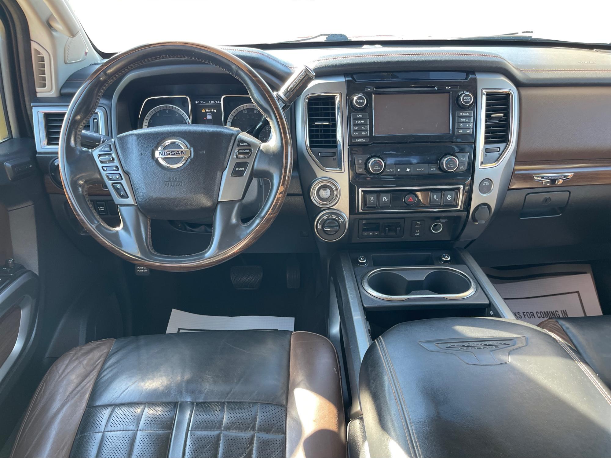 2017 Nissan Titan Platinum Reserve Crew Cab 4WD (1N6AA1E53HN) with an 5.6L V8 DOHC 32V engine, 6-Speed Automatic transmission, located at 1230 East Main St, Xenia, OH, 45385, (937) 908-9800, 39.688026, -83.910172 - 2017 Nissan Titan Platinum Reserve Crew Cab 4WD - Photo#20