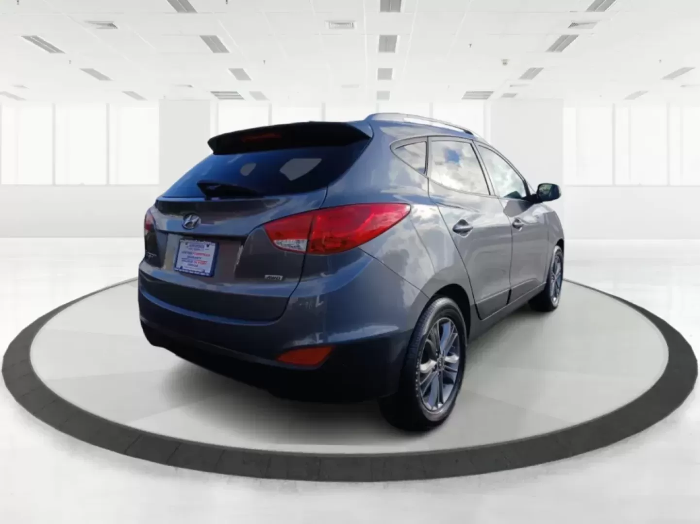 2014 Hyundai Tucson GLS AWD (KM8JUCAG3EU) with an 2.4L L4 DOHC 16V engine, 6-Speed Automatic transmission, located at 1951 S Dayton Lakeview Rd., New Carlisle, OH, 45344, (937) 908-9800, 39.890999, -84.050255 - Photo#2
