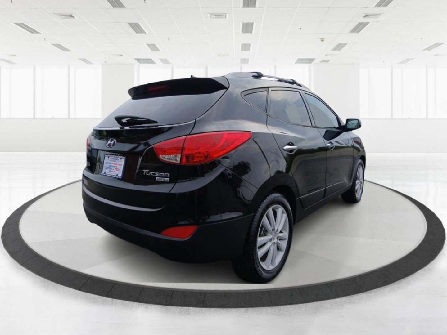 2013 Hyundai Tucson Limited 2WD (KM8JU3AC1DU) with an 2.4L L4 DOHC 16V engine, 6-Speed Automatic transmission, located at 401 Woodman Dr, Riverside, OH, 45431, (937) 908-9800, 39.760899, -84.123421 - 2013 Hyundai Tucson Limited 2WD - Photo#2