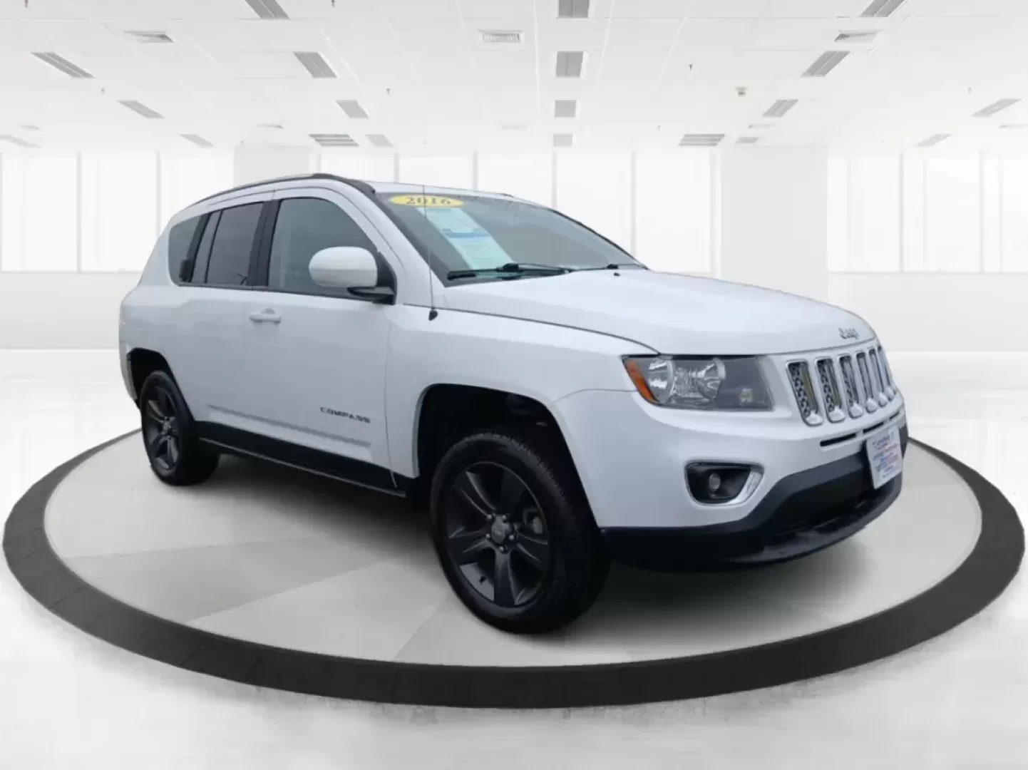 2016 Jeep Compass Latitude FWD (1C4NJCEA3GD) with an 2.0L L4 DOHC 16V engine, Continuously Variable Transmission transmission, located at 880 E. National Road, Vandalia, OH, 45377, (937) 908-9800, 39.891918, -84.183594 - 2016 Jeep Compass Latitude FWD - Photo#0