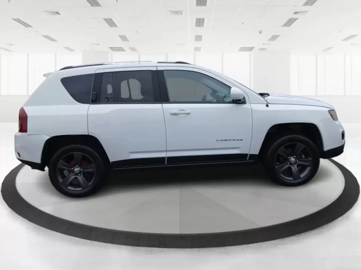 2016 Jeep Compass Latitude FWD (1C4NJCEA3GD) with an 2.0L L4 DOHC 16V engine, Continuously Variable Transmission transmission, located at 880 E. National Road, Vandalia, OH, 45377, (937) 908-9800, 39.891918, -84.183594 - 2016 Jeep Compass Latitude FWD - Photo#1