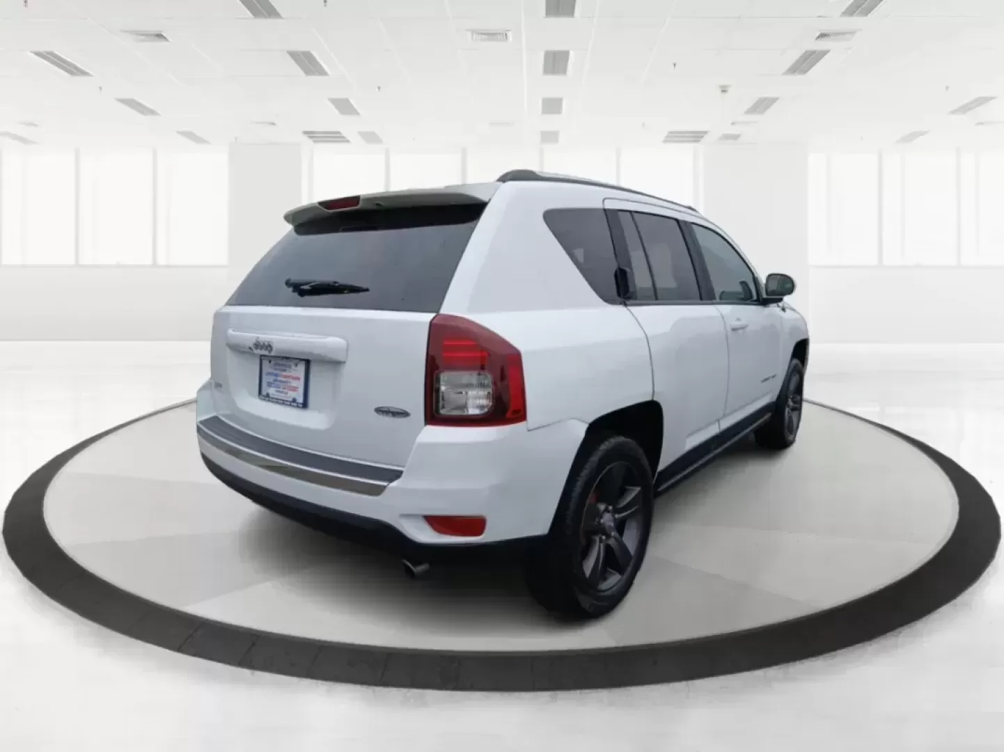 2016 Jeep Compass Latitude FWD (1C4NJCEA3GD) with an 2.0L L4 DOHC 16V engine, Continuously Variable Transmission transmission, located at 880 E. National Road, Vandalia, OH, 45377, (937) 908-9800, 39.891918, -84.183594 - 2016 Jeep Compass Latitude FWD - Photo#2