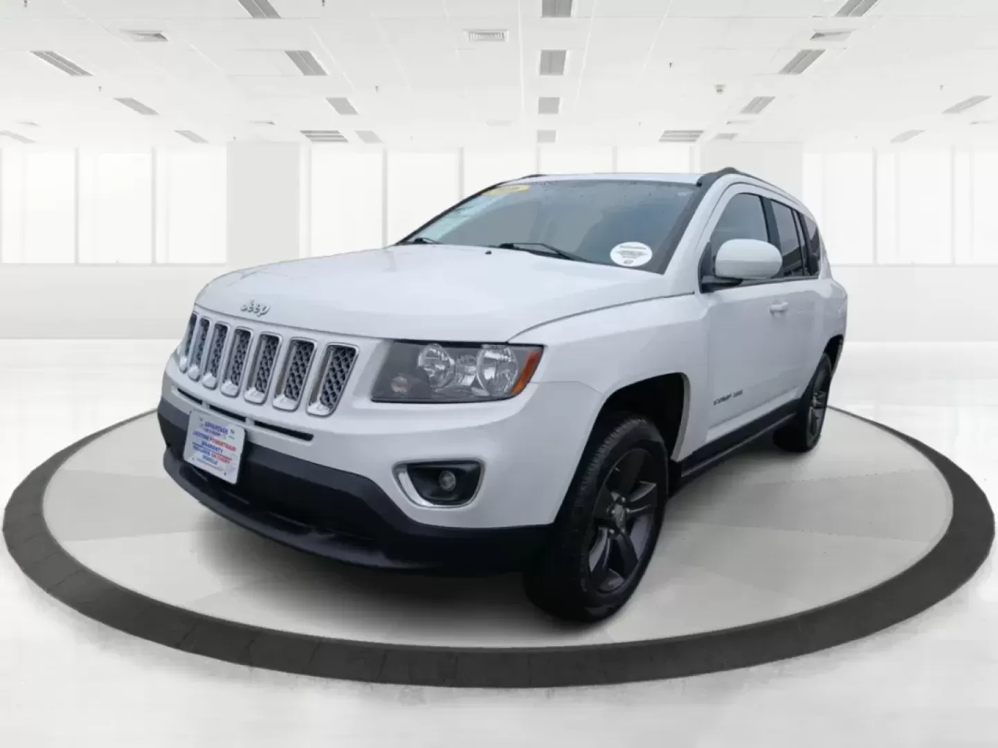 2016 Jeep Compass Latitude FWD (1C4NJCEA3GD) with an 2.0L L4 DOHC 16V engine, Continuously Variable Transmission transmission, located at 880 E. National Road, Vandalia, OH, 45377, (937) 908-9800, 39.891918, -84.183594 - 2016 Jeep Compass Latitude FWD - Photo#8