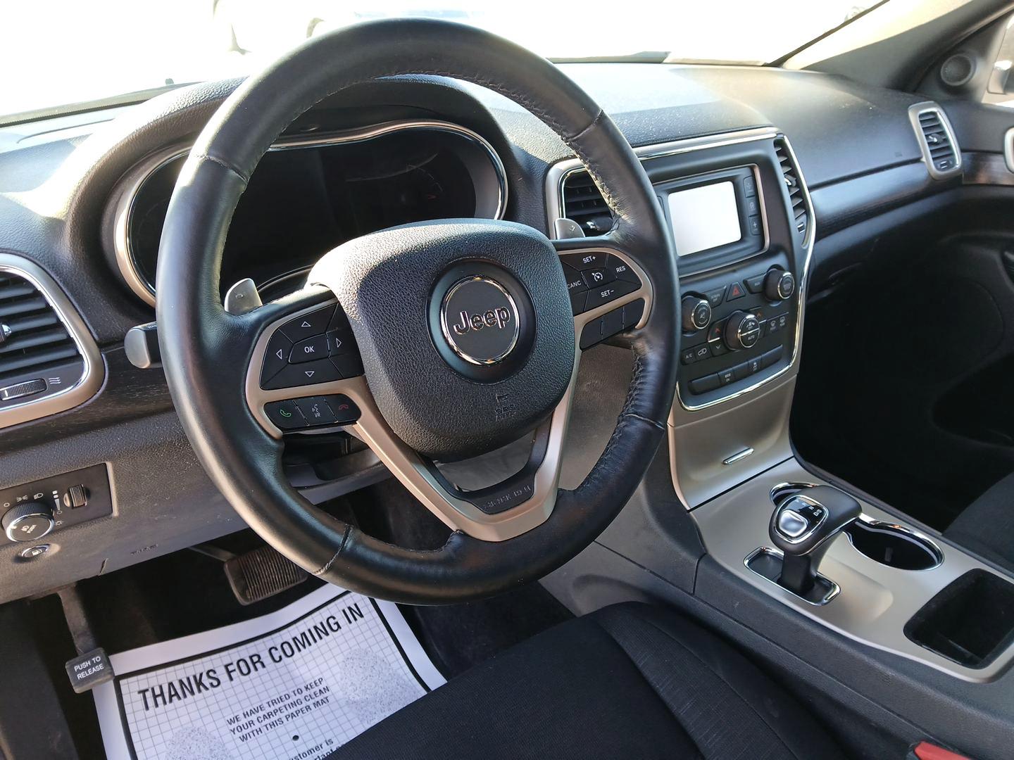 2014 Jeep Grand Cherokee Laredo 4WD (1C4RJFAG1EC) with an 3.6L V6 DOHC 24V engine, 5-Speed Automatic transmission, located at 880 E. National Road, Vandalia, OH, 45377, (937) 908-9800, 39.891918, -84.183594 - 2014 Jeep Grand Cherokee Laredo 4WD - Photo#7