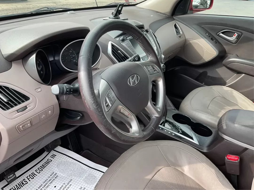 2013 Hyundai Tucson Limited (KM8JU3AC4DU) with an Theta II 2.4L I-4 DOHC engine, located at 1099 N County Rd 25A , Troy, OH, 45373, (937) 908-9800, 40.057079, -84.212883 - 2013 Hyundai Tucson Limited - Photo#8