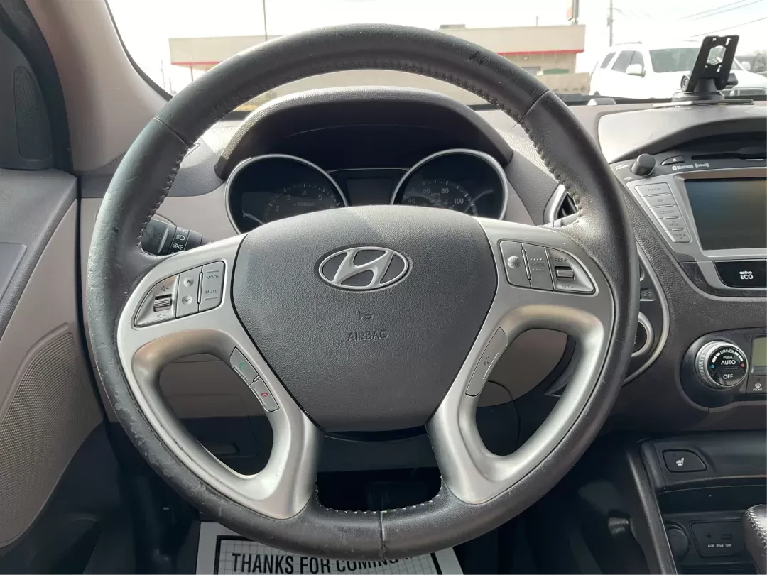 2013 Hyundai Tucson Limited (KM8JU3AC4DU) with an Theta II 2.4L I-4 DOHC engine, located at 1099 N County Rd 25A , Troy, OH, 45373, (937) 908-9800, 40.057079, -84.212883 - 2013 Hyundai Tucson Limited - Photo#15
