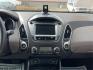 2013 Hyundai Tucson Limited (KM8JU3AC4DU) with an Theta II 2.4L I-4 DOHC engine, located at 1099 N County Rd 25A, Troy, OH, 45373, (937) 908-9800, 40.057079, -84.212883 - Photo#11